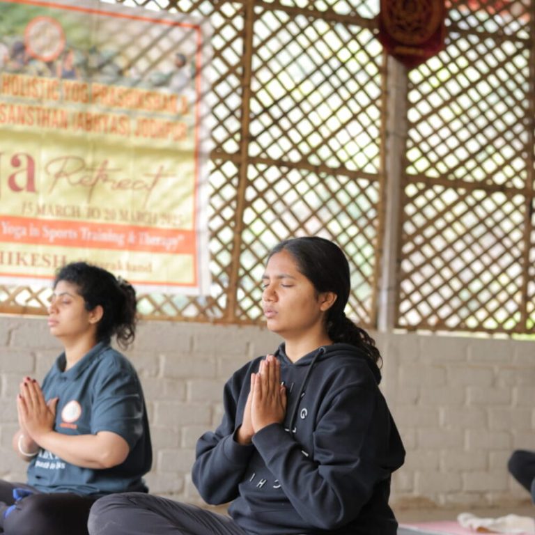 Meditation class at Art of Yog studio with participants in calm posture